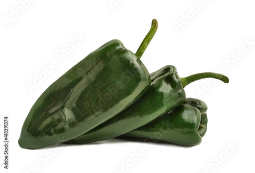three  poblano peppers (Capsicum annuum) with copy space