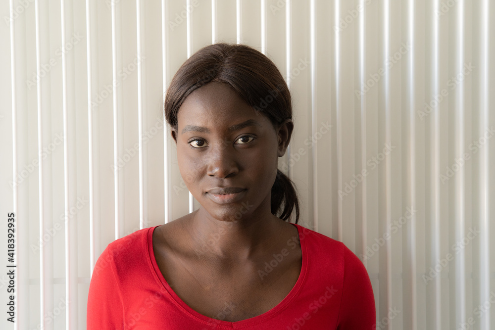 Young woman in red tshirt, head and shoulder portrait Young woman in red tshirt, head and shoulder portrait