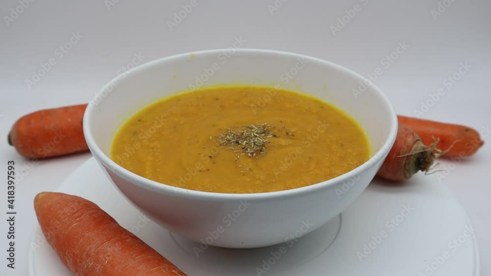 Carrot cream soup (vellutata di carote) isolated on white background Carrot cream soup (vellutata di carote) isolated on white background