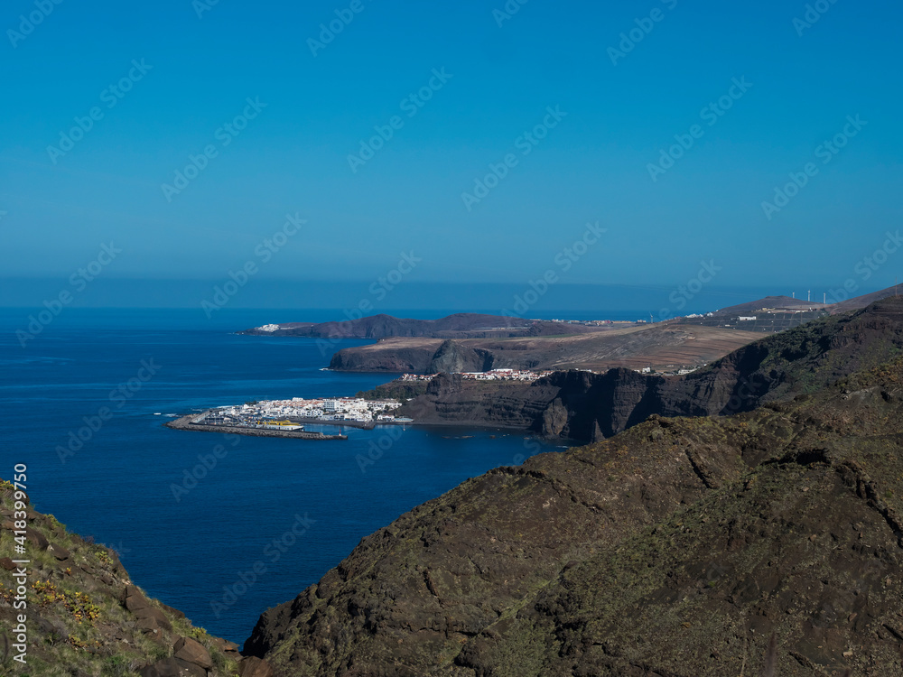 Seascape view of Puerto de las Nieves, traditional fishing village port with cliffs and rocky atlantic coast in the north west of Gran Canaria, Canary Islands, Spain.