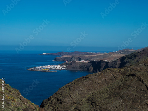 Seascape view of Puerto de las Nieves, traditional fishing village port with cliffs and rocky atlantic coast in the north west of Gran Canaria, Canary Islands, Spain.