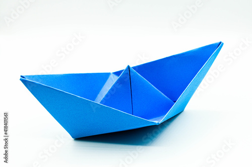 Origami boat isolated on white background.