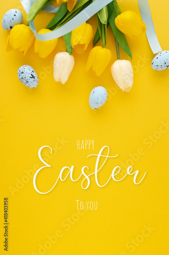 Happy easter background with eggs and tulips and lettering © Daniel
