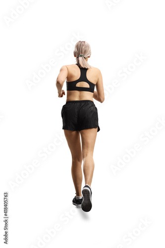 Full length rear shot of a woman in sportswear running