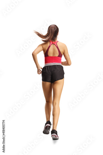 Rear view of a fit woman in sportswear running