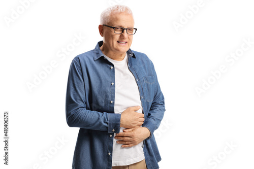 Mature man holding his stomach and experiencing pain