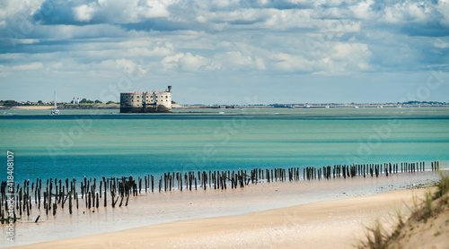 Fort Boyard in the Oleron Island during summer with turquoise ocean and scenic clouds photo