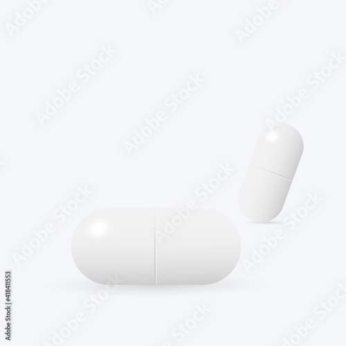 Two white medicine capsules.