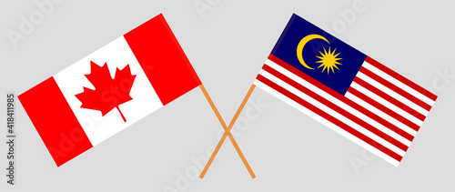 Crossed flags of Canada and Malaysia. Official colors. Correct proportion