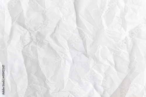 abstract background of crumpled white parchment texture close up
