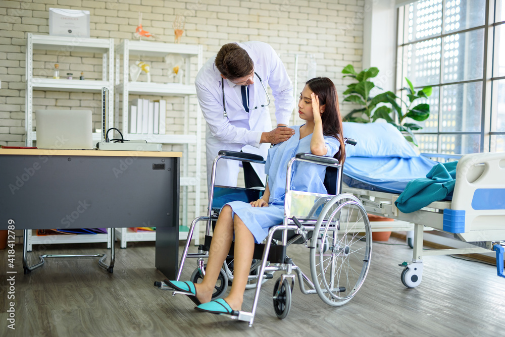 Fototapeta premium Working women have a headache on a wheelchair inside the clinic.