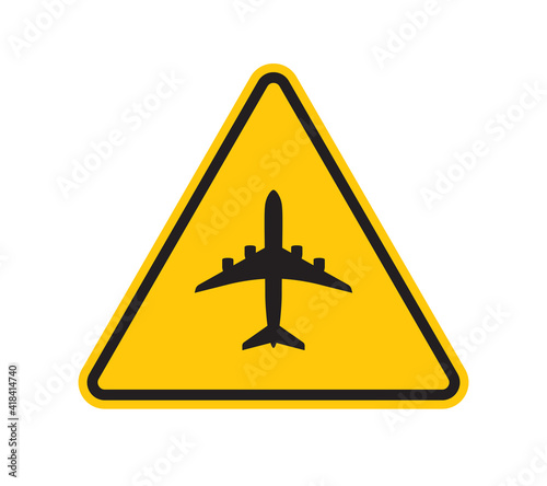 Vector yellow triangle sign - black silhouette aircraft symbol. Isolated on white background. 