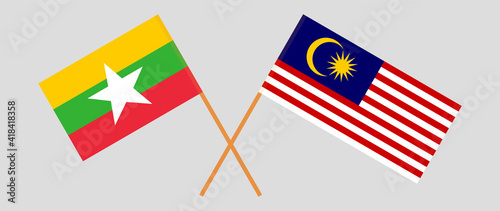 Crossed flags of Myanmar and Malaysia. Official colors. Correct proportion