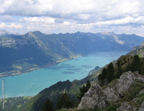 View down onto the turquoise blue waters of Brienzersee from Shynige Platte, Switzerland, with Rothorn mountain at the far end of the lake