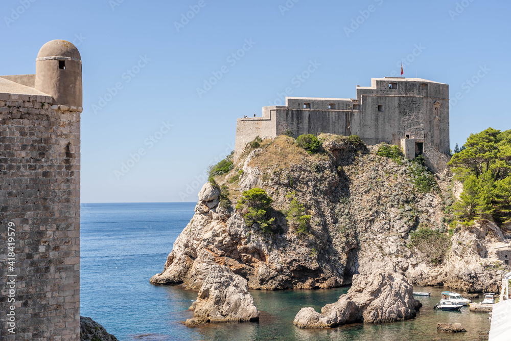 Dubrovnik, Croatia - Aug 22, 2020: West harbour with Fort Lovrijenac in Dubrovnik old town in summer