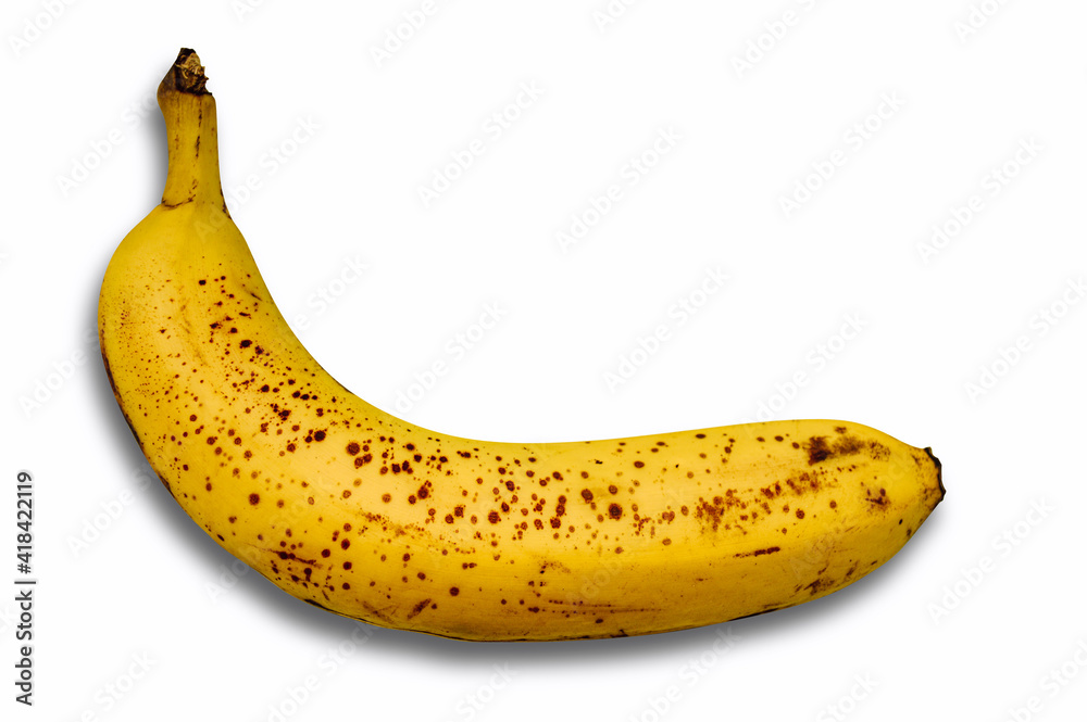 Spoiled banana with spots on a white background