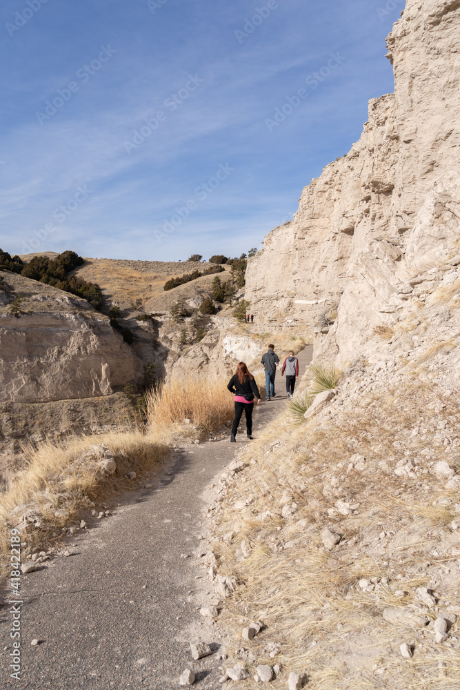 three hikers on a trail three hikers on a trail