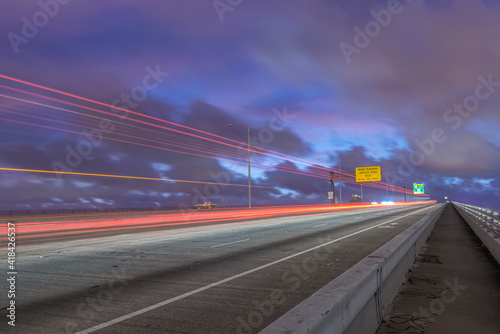 USA, Florida, Miami. Traffic trails on MacArthur Causeway at dawn. © Danita Delimont