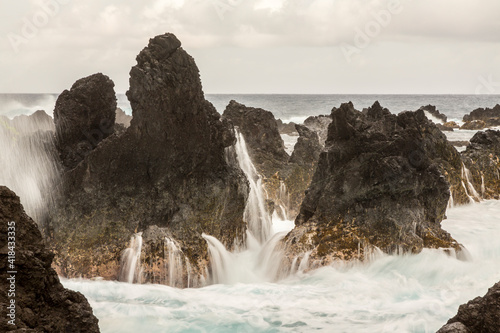 USA, Hawaii, Laupahoehoe Beach Point State Park. Crashing waves on shore rocks.