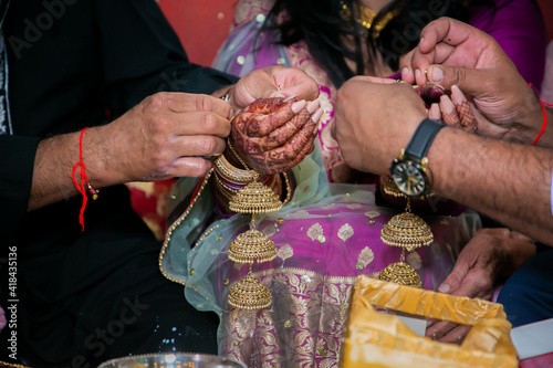 Indian Punjabi pre wedding Choora ceremony ritual items, bangles and hands close up