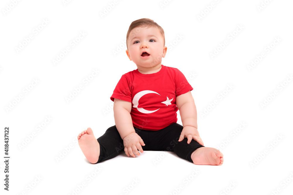 Portrait of happy little kid, cute baby toddler with Turkish flag t-shirt isolated on white. Patriotic holiday. Adorable child celebrates national holidays. Portrait of happy little kid, cute baby toddler with Turkish flag t-shirt isolated on white. Patriotic holiday. Adorable child celebrates national holidays.