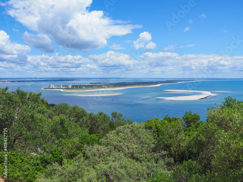 Troia Peninsula or Tróia Nature Reserve is part of Sado Estuary natural park. Atlantic Ocean and azure lagoon. Popular tourist destination, resort with long sandy beaches. Beautiful Portuguese scenery