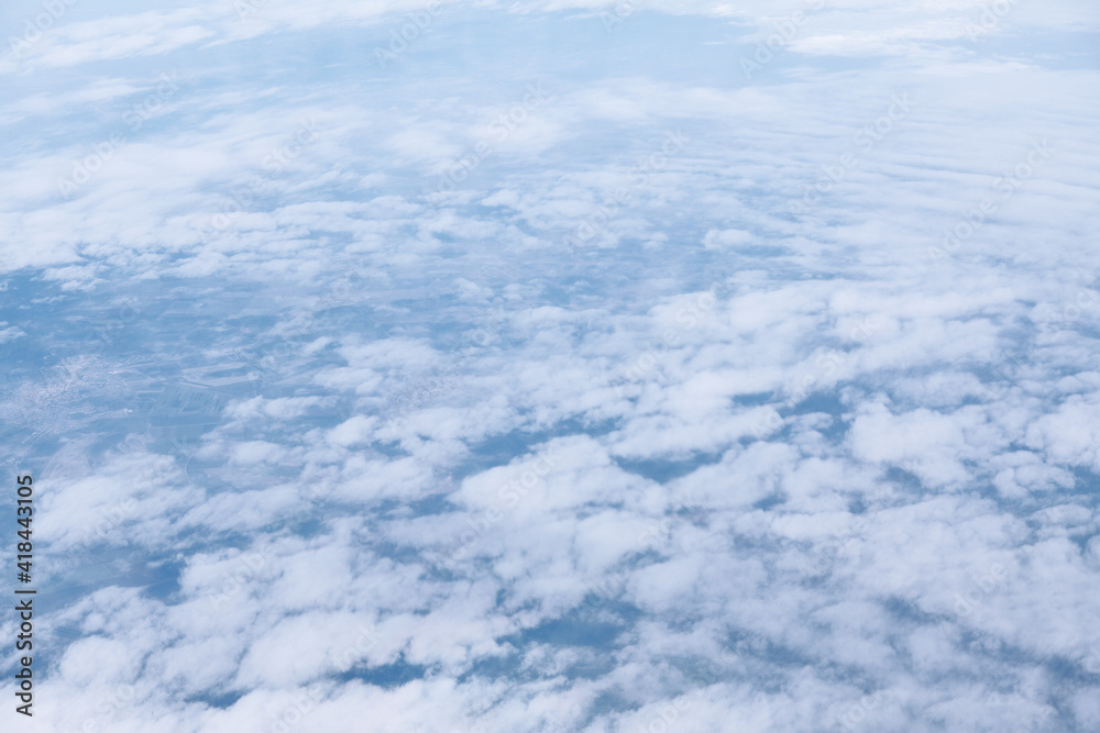 High above the clouds over the earth High above the clouds over the earth