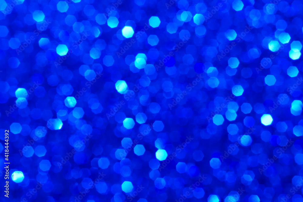 Abstract dark aquamarine and blue glitter lights background. Blurred bokeh. Festive backdrop for Christmas, holiday, event. Winter card or invitation