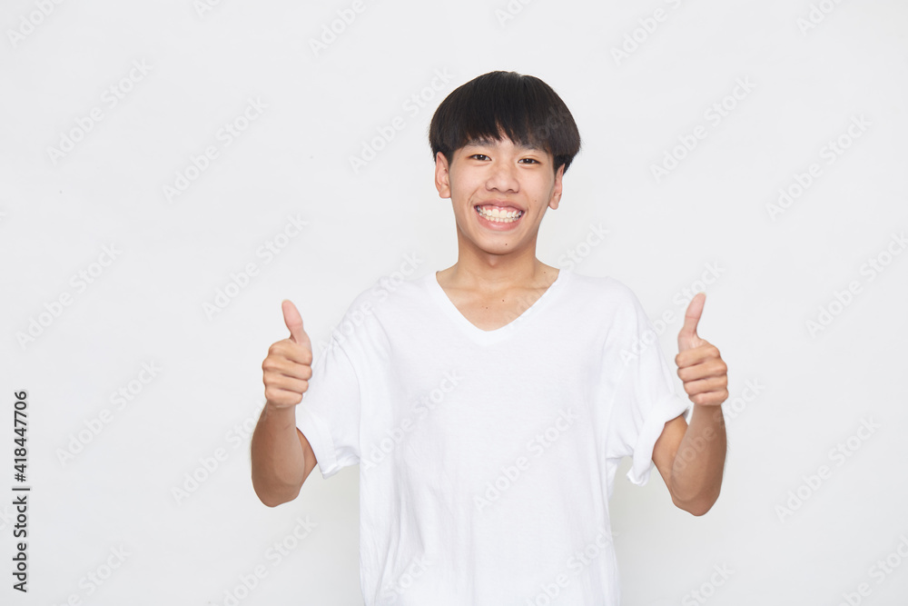 Asian young man going thumb up