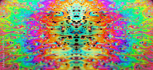 Macro photo of a soap-bubble in the colors of a rainbow