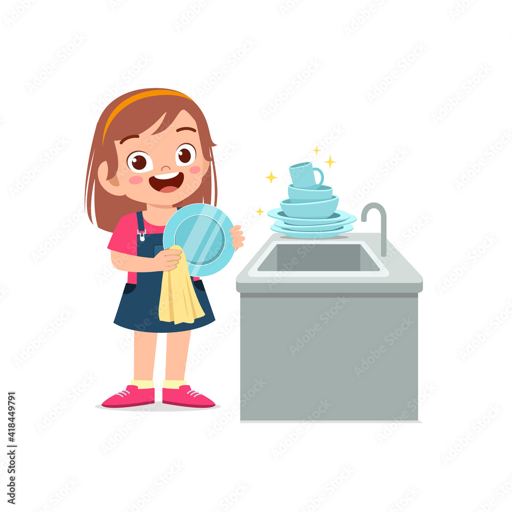 happy cute little girl washing dish in the kitchen