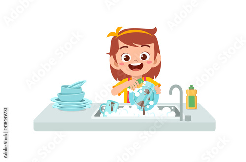 happy cute little girl washing dish in the kitchen