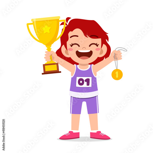 happy cute little girl holding gold medal and trophy