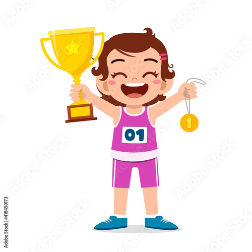 happy cute little girl holding gold medal and trophy