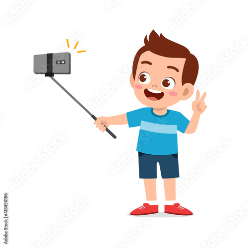 cute little kid boy pose and selfie in front of camera