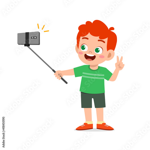cute little kid boy pose and selfie in front of camera