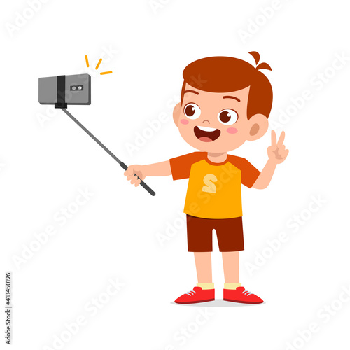 cute little kid boy pose and selfie in front of camera