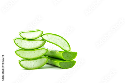 Slices of fresh green aloe vera plant stacked and aloe vera stalk or leaves with water dropping isolate on white background.