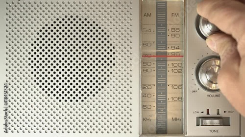 Tuning through stations on a vintage radio