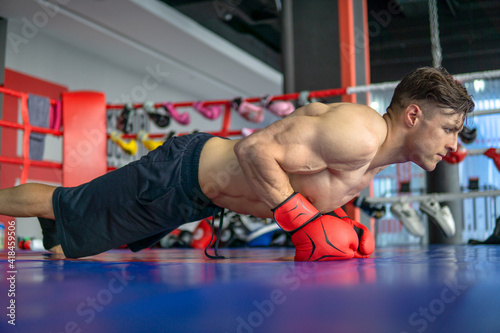 Boxer doing push ups before fight