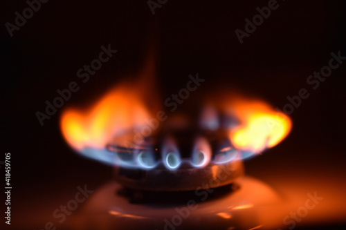  Natural gas burning a blue flames on black background