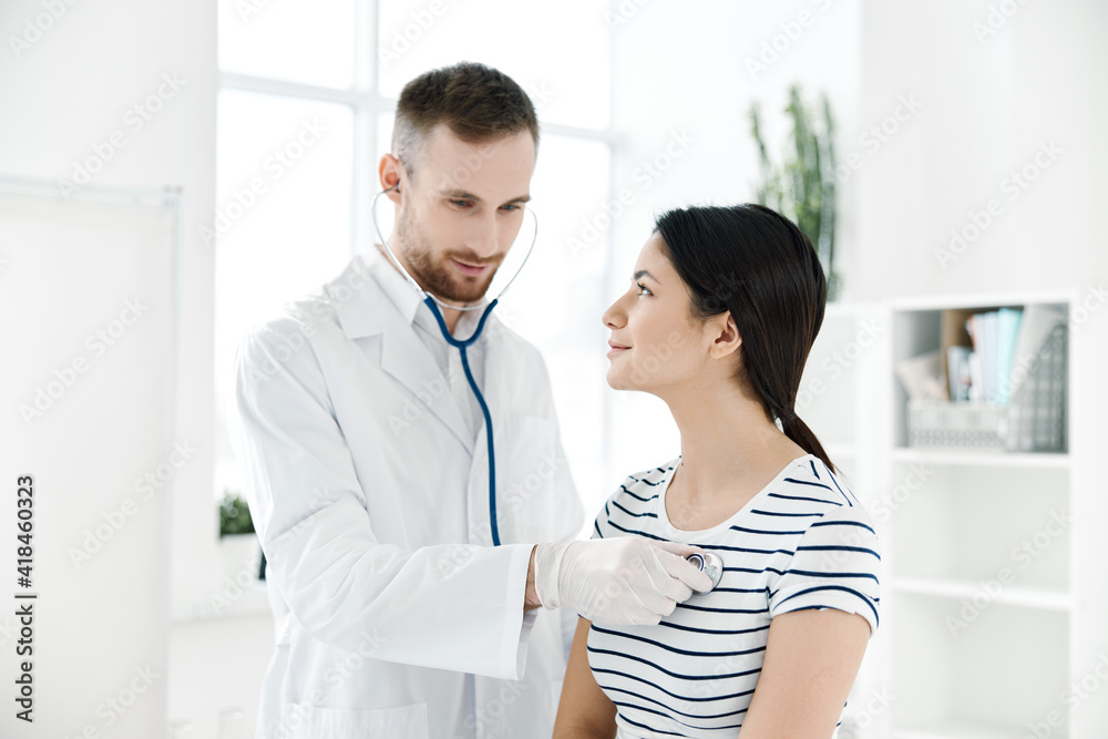 male doctor examines a patient in health hospitals male doctor examines a patient in health hospitals