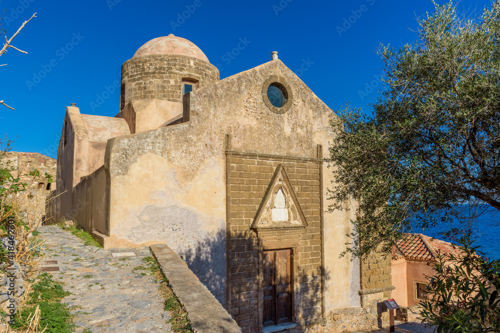 Traditional architecture with  narrow  stone street  and agios nikolaos  church  in  the medieval  castle of Monemvasia, Lakonia, Peloponnese, Greece.