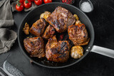 Baked short beef ribs , on black stone background