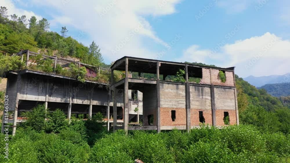 Ruined lost overgrown mining ghost town Akarmara, consequences of war in Abkhazia, aerial view from drone Ruined lost overgrown mining ghost town Akarmara, consequences of war in Abkhazia, aerial view from drone