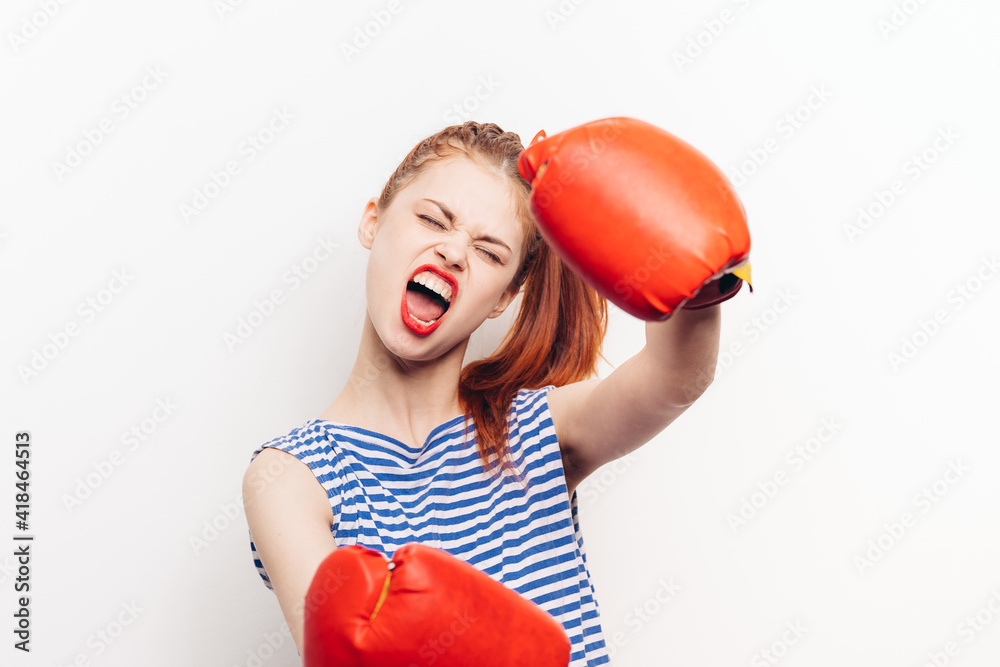boxing woman in red gloves striped t-shirt makeup hairstyle boxing woman in red gloves striped t-shirt makeup hairstyle
