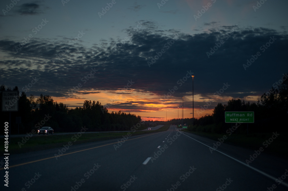 Sunset driving through Anchorage, Alaska highway