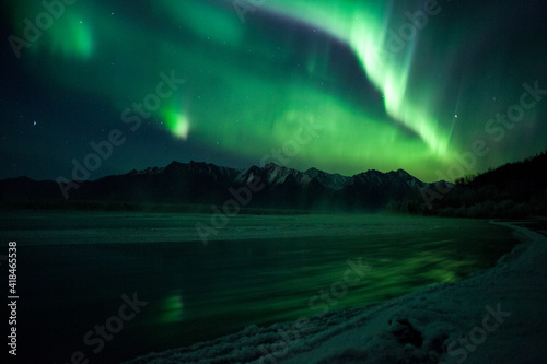 Aurora over Alaskan mountains © KBDESIGNPHOTO