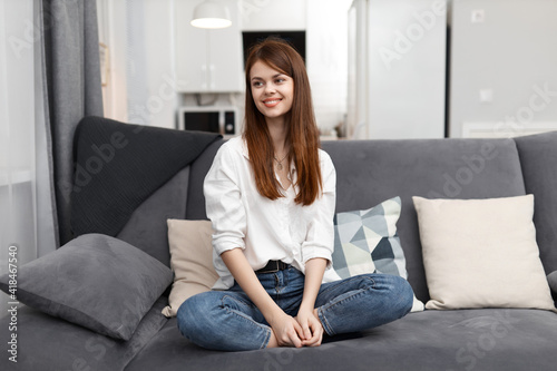 woman at home on the couch rest Comfort in the apartment