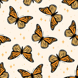 Seamless pattern with monarch butterflies. Contemporary composition for print. Hand drawn vector illustration.